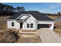 New construction home featuring an attached garage, black roof, and covered entryway in a suburban neighborhood at 1068 Jase Dr., Longs, SC 29568