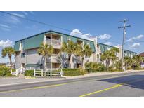 Charming condo with palm trees and a private balcony overlooking the street at 4201 N Ocean Blvd. # 2M, North Myrtle Beach, SC 29582