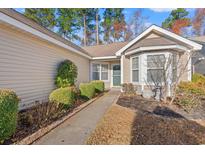 Inviting single-story home featuring manicured landscaping and a welcoming front entrance at 352 Mckendree Ln., Myrtle Beach, SC 29579
