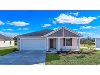 Single-Gathering home featuring a well-manicured lawn and a two-car garage at 60 Cape Point Dr., Conway, SC 29527