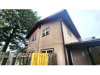 The exterior elevation is of a two-story home with a fenced yard at 618 35Th Ave. N # C, Myrtle Beach, SC 29577