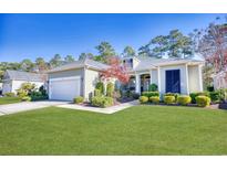Charming single-story home with well-maintained landscaping, a two-car garage, and a neatly manicured lawn at 190 Sugar Loaf Ln., Murrells Inlet, SC 29576