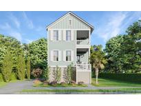 Two-story light green house with a detached garage and landscaping at 1017 Tarpon Pond Rd., North Myrtle Beach, SC 29582