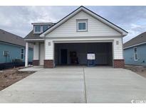 New construction home features a charming exterior and attached garage at 1237 Crested Iris Way, North Myrtle Beach, SC 29582