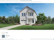 Charming two-story home featuring white siding, a small porch, and an attached garage at 2404 Hillbourne Loop, North Myrtle Beach, SC 29582