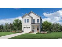 Charming two-story home featuring white siding, a front-entry garage, and a well-manicured lawn at 2620 Hillbourne Loop, North Myrtle Beach, SC 29582