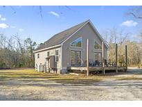Charming single story home with a large deck and pond at 149 Juniper Ridge Rd., Conway, SC 29527
