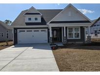 Charming single-Gathering home with a two-car garage and covered front porch at 300 Starlit Way, Myrtle Beach, SC 29579