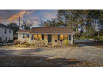 Charming bungalow exterior featuring a covered porch and well-maintained landscaping at 4502 Eyerly St., North Myrtle Beach, SC 29582