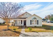 Charming single-story home with a well-maintained lawn, mature tree, and welcoming entryway at 1108 Blue Juniper Ct., Conway, SC 29527