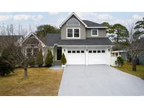 Charming two-story home with a two-car garage and neutral toned color scheme, enhanced by a well-manicured front yard at 2109 N Berwick Dr., Myrtle Beach, SC 29575