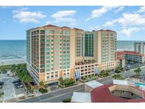 Stunning high-rise ocean-view condo building boasts luxurious architecture and prime beachfront location at 603 S Ocean Blvd. # 1002, North Myrtle Beach, SC 29582