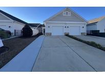 Two-car garage and front entrance of charming townhome at 736 Salerno Circle # D, Myrtle Beach, SC 29579