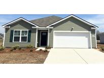 Charming one-story home with green siding, a two-car garage, and a well-manicured front yard at 835 Buttonwood Dr., Conway, SC 29527