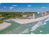 Stunning aerial view of the beach, oceanfront condos, and coastline showcasing beautiful ocean view at 9400 Shore Dr. # 312, Myrtle Beach, SC 29572