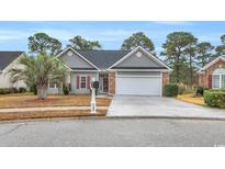 Charming one-story home featuring a two-car garage and well-manicured front yard at 158 Regency Dr., Conway, SC 29526