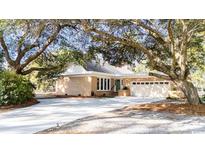 Ranch home with attached garage and mature landscaping at 272 Old Ashley Loop, Pawleys Island, SC 29585