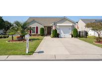 Attractive single-story home with landscaped yard and driveway at 4001 Scarlet Oak Ct., Myrtle Beach, SC 29579