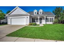 Craftsman style home with attached garage and manicured lawn at 100 Barons Bluff Dr., Conway, SC 29526