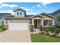 Charming home featuring a two-car garage and landscaped front yard, creating inviting curb appeal at 2291 Heritage Loop, Myrtle Beach, SC 29577