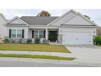 Charming one-story home with gray siding, a black door, and a two-car garage at 417 Grain Field Dr., Georgetown, SC 29440