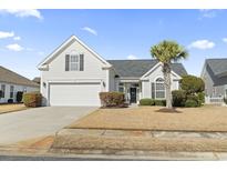 Charming home featuring a manicured lawn and attached garage, perfect for suburban living at 729 Woodcrest Way, Murrells Inlet, SC 29576