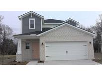 Two-story brick home with gray accents and a two-car garage at 2048 Copper Creek Loop, Longs, SC 29568