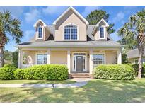 Beautiful two-story house with a charming front porch and well-manicured lawn at 2332 Clandon Dr., Myrtle Beach, SC 29579