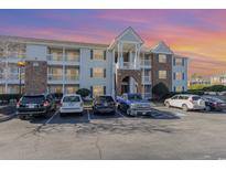 Two-story apartment building with ample parking and a landscaped area at 3762 Citation Way # 1018, Myrtle Beach, SC 29577
