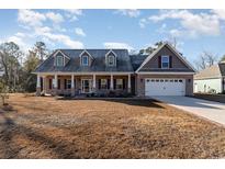 Brick home with a large front porch and 2-car garage at 101 Bantry Ln., Conway, SC 29526