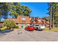 Front view of a townhouse with brick and brown roof at 1025 Carolina Rd. # Z4, Conway, SC 29526