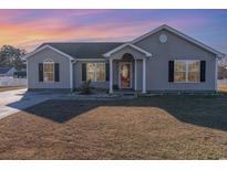 Charming one-story house with a well-manicured lawn at 1049 Augustus Dr., Conway, SC 29527