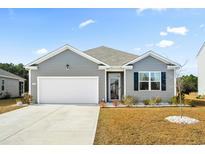 Gray exterior house with white garage door and landscaping at 1052 Ridgeford Dr., Conway, SC 29526