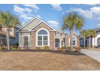 Beautiful craftsman style home with stone accents and palm trees at 1113 Bluffton Ct., Myrtle Beach, SC 29579