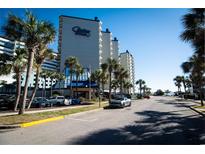 Carolina Winds oceanfront resort building, ample parking and palm trees at 200 76Th Ave. N # 409, Myrtle Beach, SC 29572