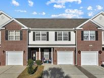Brick front of charming townhome with 2-car garage and welcoming porch at 280 B Connemara Dr. # B, Myrtle Beach, SC 29579