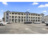 Attractive three-story building with ample parking at 4522 N Planatation Harbour Dr. # E13, Little River, SC 29566