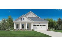 Craftsman style home with two-car garage and landscaped front yard at 5035 Whitsett St., Murrells Inlet, SC 29576