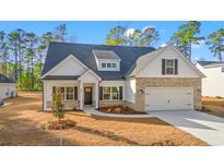 Beautiful two-story home with brick accents and a large front yard at 800 Caines Landing Rd., Conway, SC 29526