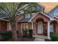 Inviting exterior with a charming front porch and landscaping at 4505 Lightkeepers Way # 24E, Little River, SC 29566