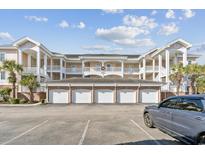 Inviting condo building with multiple garages and ample parking at 4847 Carnation Circle # 203, Myrtle Beach, SC 29577