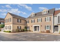 Tan colored two-story building with multiple units and parking at 501 44Th Ave. N # D-3, Myrtle Beach, SC 29577