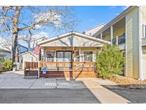 Charming cottage with a spacious front porch and well-maintained landscaping at 6001-5732 S Kings Hwy., Myrtle Beach, SC 29575