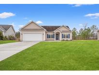 Charming single Gathering home with a well maintained lawn, driveway, and two car garage at 817 Payne Ct., Conway, SC 29526
