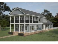 Two-story house with gray siding, white trim, and a balcony at 239 Madison Dr., Georgetown, SC 29440
