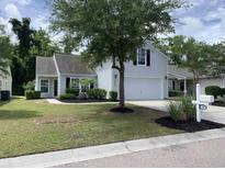 One-story house with attached garage, landscaping, and a tree in the front yard at 295 Bellegrove Dr., Myrtle Beach, SC 29579