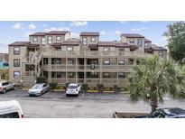 Condo building with parking and balconies at 501 Maison Dr. # G-14, Myrtle Beach, SC 29572