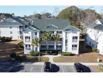 Aerial view of condo community near golf course and pond at 517 White River Ct. # 22A, Myrtle Beach, SC 29579