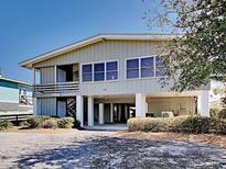 Elevated beach home with spacious deck and walkway at 102 Seaview Loop, Pawleys Island, SC 29585