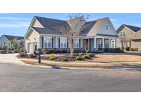 Charming single-story home boasts a manicured front yard and inviting entrance at 1405 Osprey Pointe Ln., North Myrtle Beach, SC 29582